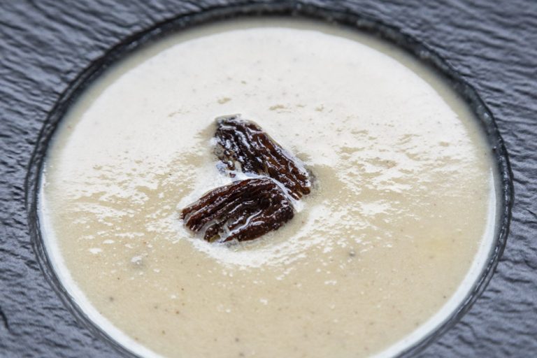 cauliflower soup topped with morel mushrooms